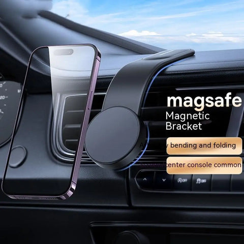 A smartphone magnetically attached to a sleek black dashboard mount while wireless charging in a car.