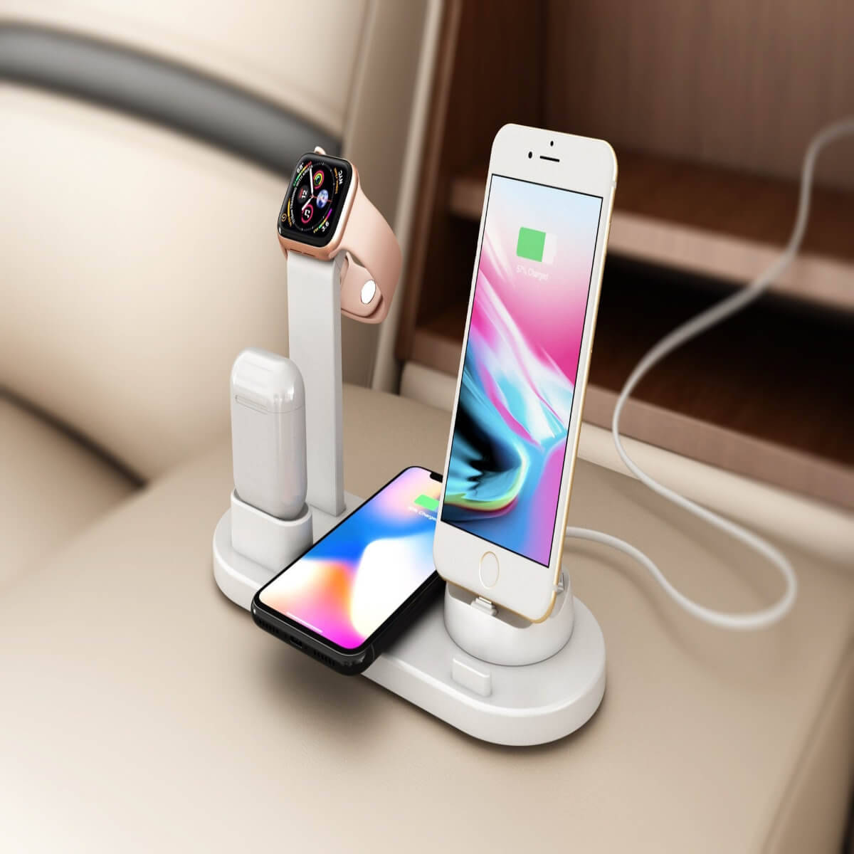 White 4-in-1 wireless charging stand powering a phone and smartwatch on a tidy nightstand for overnight organization.
